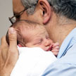 Parent holding a newborn baby